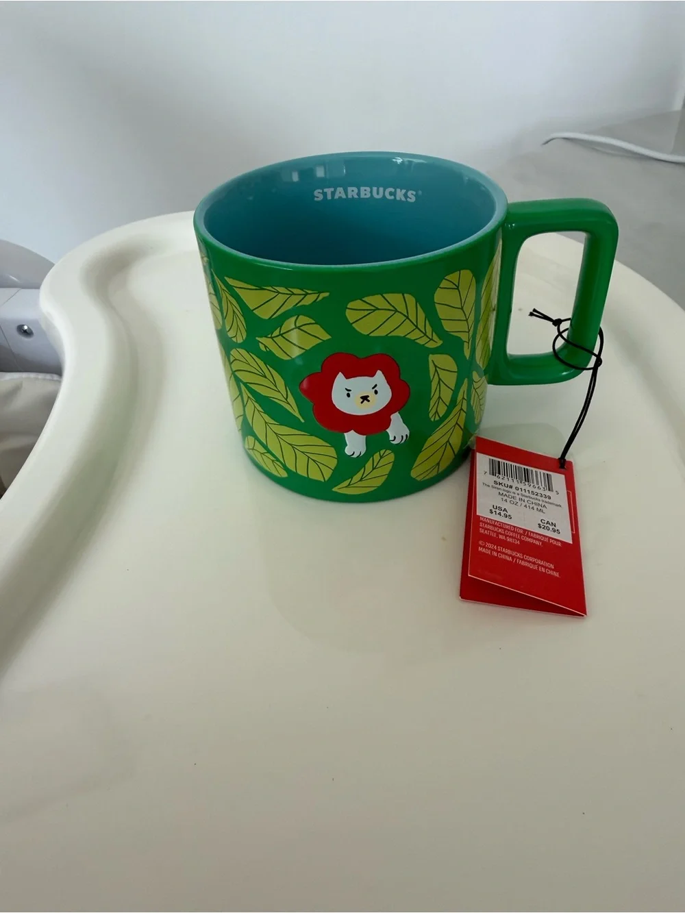 Starbucks Green and Teal Ceramic Mug with Leaf and Lion Motif